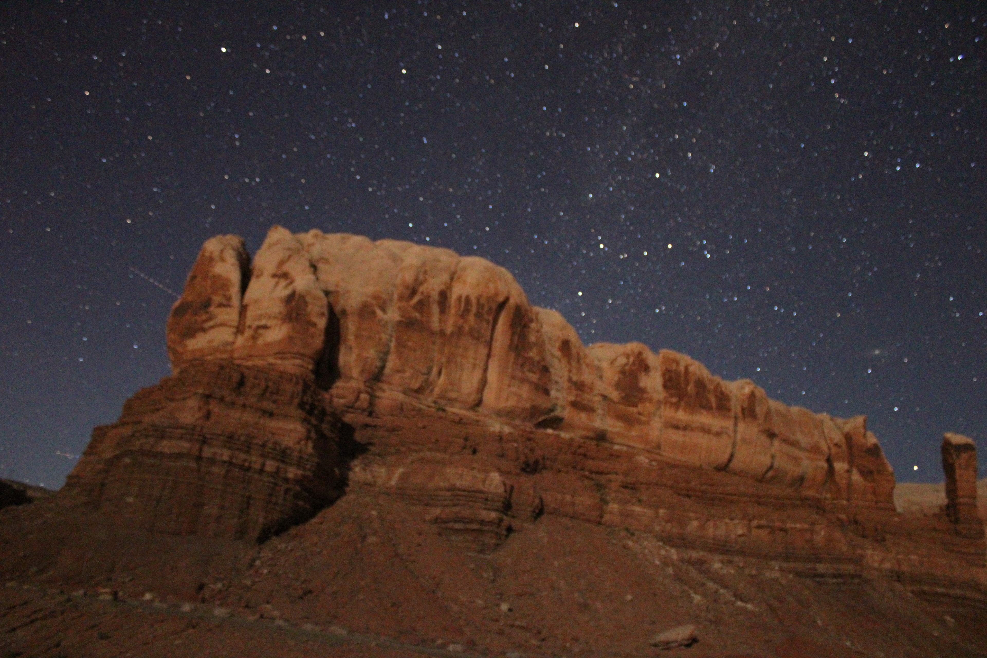 Red rock canyon walls beneath a starry sky near Bluff, Utah
